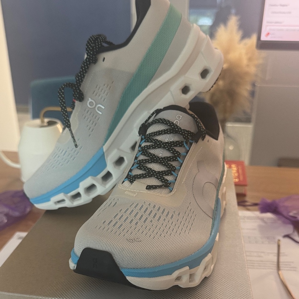 On Running Shoes with Blue and White Accents